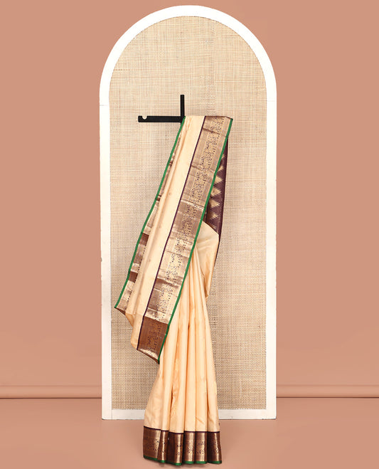 Sandal Vasundhara Silk Saree, Sparsely Woven with Zari Buttas All Over Its Body, Complemented by Contrast Border of Mayil Kann and Yaanai Designs, Grandly Decked Up Pallu and Paired with a Contrast Blouse