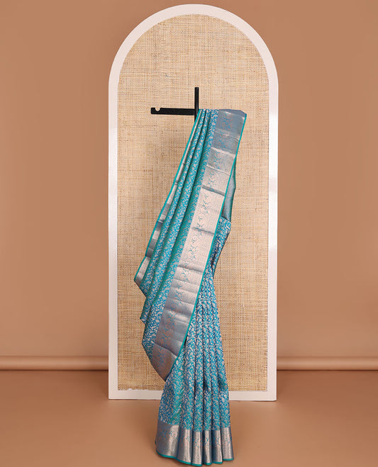 Blue vanasingari-style jacquard woven wedding silk saree, intricate pallu & border of thilakam mokku,kodi visiry,kathir,laddu kamalam & mayil