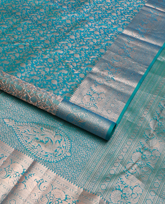 Blue vanasingari-style jacquard woven wedding silk saree, intricate pallu & border of thilakam mokku,kodi visiry,kathir,laddu kamalam & mayil