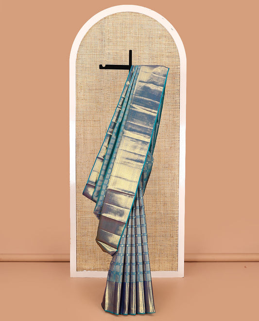 Blue jacquard kanchipuram silk saree, zari border of thilakam mokku, neli, kodi visiry, jada nagam, and jaal designs, and jaal pallu