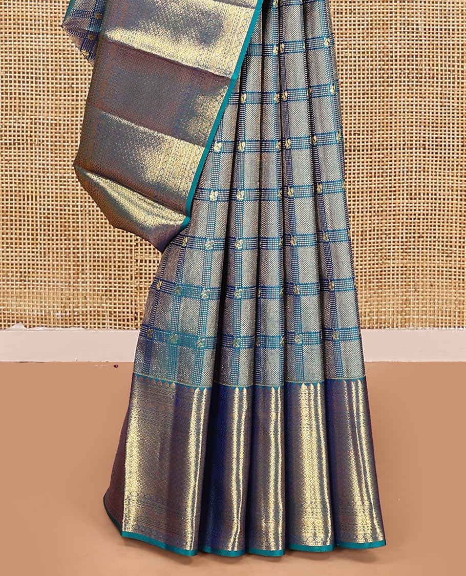 Blue jacquard kanchipuram silk saree, zari border of thilakam mokku, neli, kodi visiry, jada nagam, and jaal designs, and jaal pallu