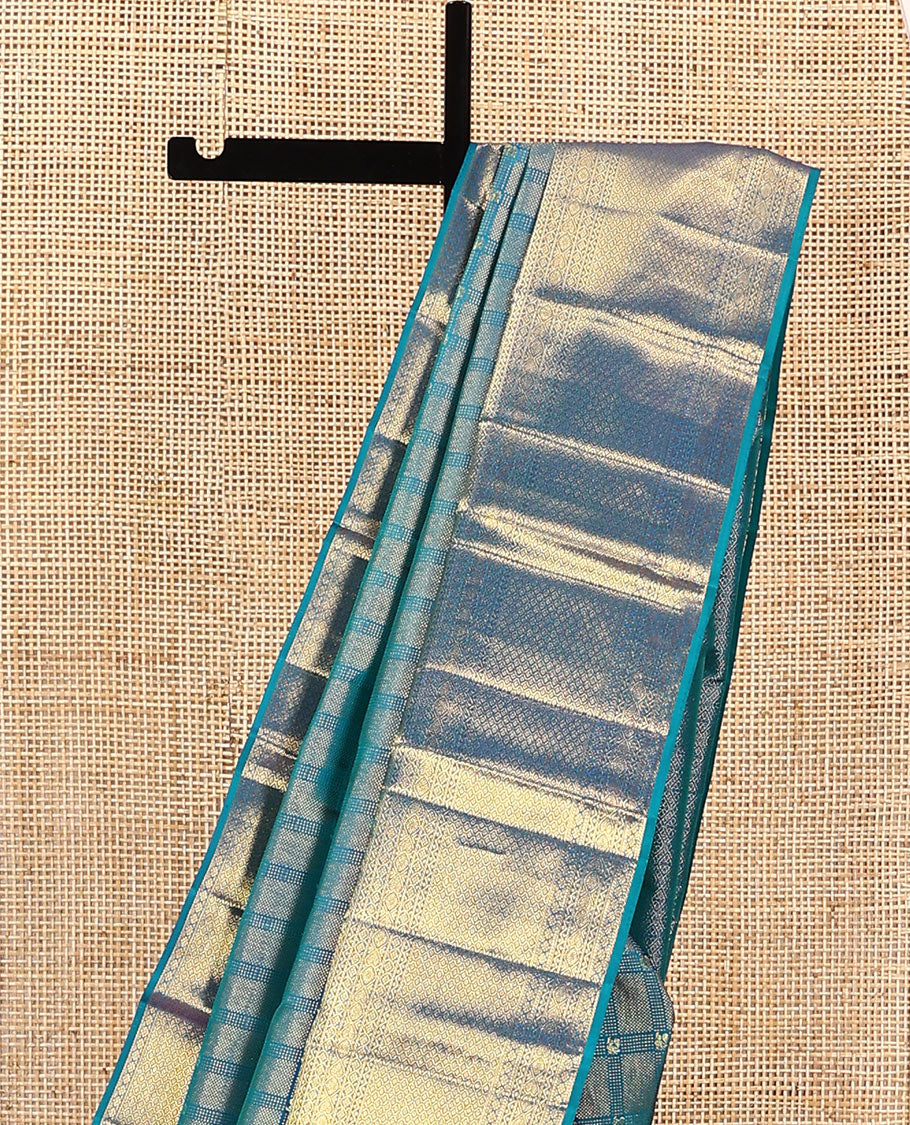 Blue jacquard kanchipuram silk saree, zari border of thilakam mokku, neli, kodi visiry, jada nagam, and jaal designs, and jaal pallu