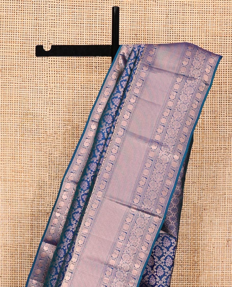 Blue Kanchipuram Wedding Silk Saree, Detailed with Jacquard Design on Its Body, Highlighted by Zari Border of Thilakam, Kodi Visiry, Mayil, and Poun Designs, Grand Pallu, and Paired with a Matching Blouse