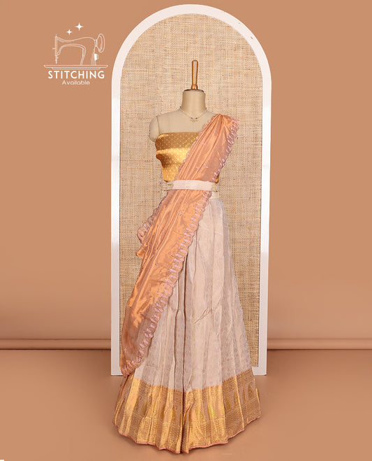 Beige art silk half-saree, brocade with contrast traditional border skirt, contrast brocade blouse, scallop embroidered dhavani, and detachable belt
