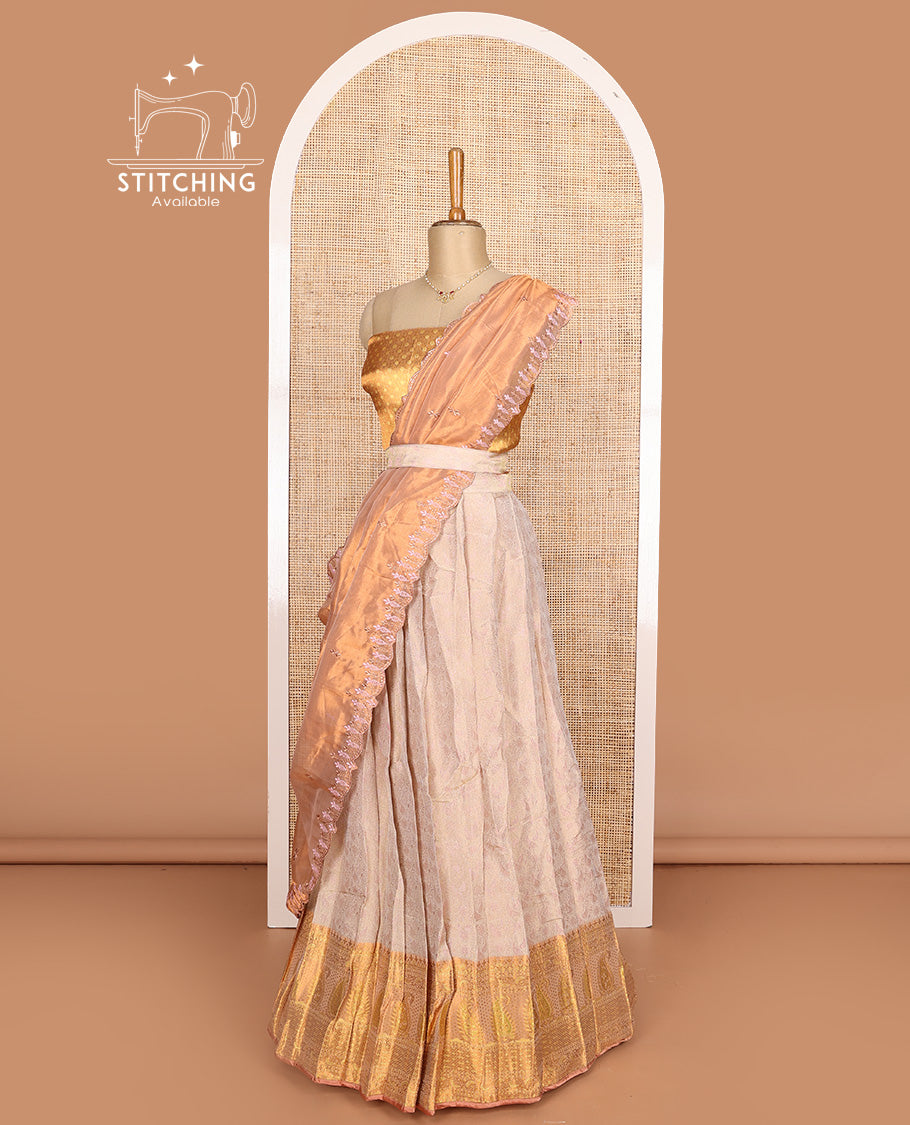 Beige art silk half-saree, brocade with contrast traditional border skirt, contrast brocade blouse, scallop embroidered dhavani, and detachable belt