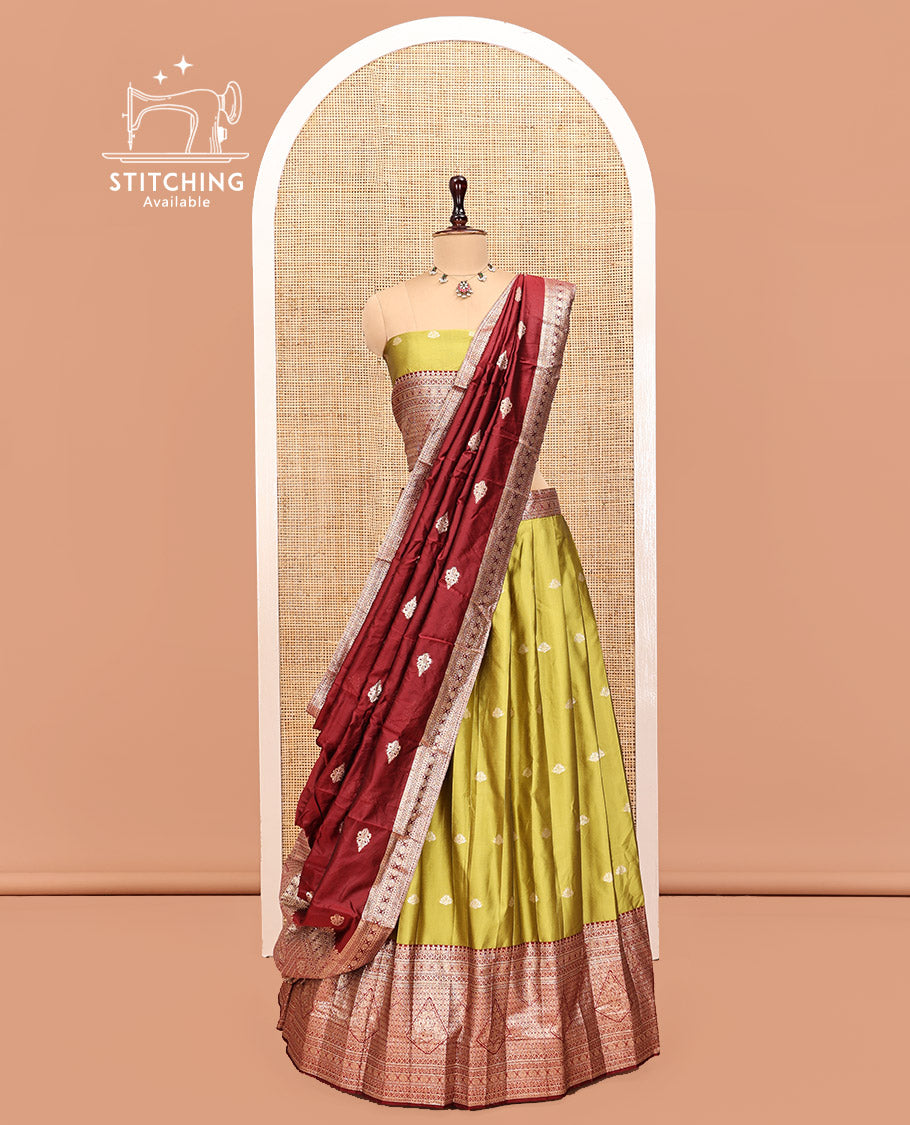Green Art Silk Half Saree, Adorned with Buttas Skirt, Contrast Traditional Border, Matching Blouse, and a Contrast Banaras Dhavani