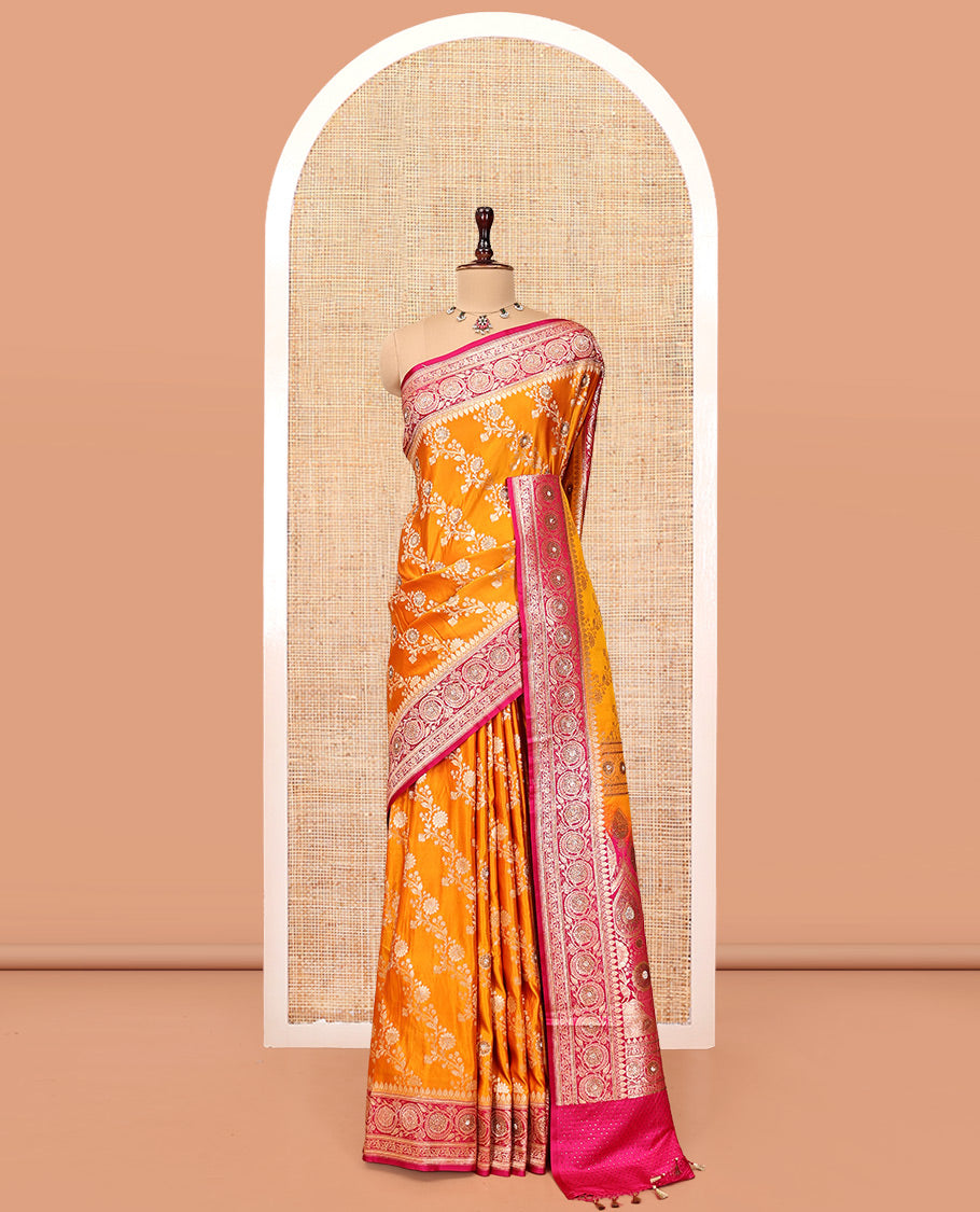 Orange Banarasi Satin Saree, Mesmerized with Floral Jaal Jacquard, a Contrast Floral Creeper Border, Intricate Stonework Pallu, and a Contrast Blouse