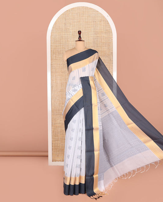 Grey Semi-Silk Cotton Saree, Embellished with Buttas and Stripes All Over Its Body, Complemented by a Contrast Traditional Zari Design Border, Pallu of Jaal Designs, and Paired with a Matching Blouse