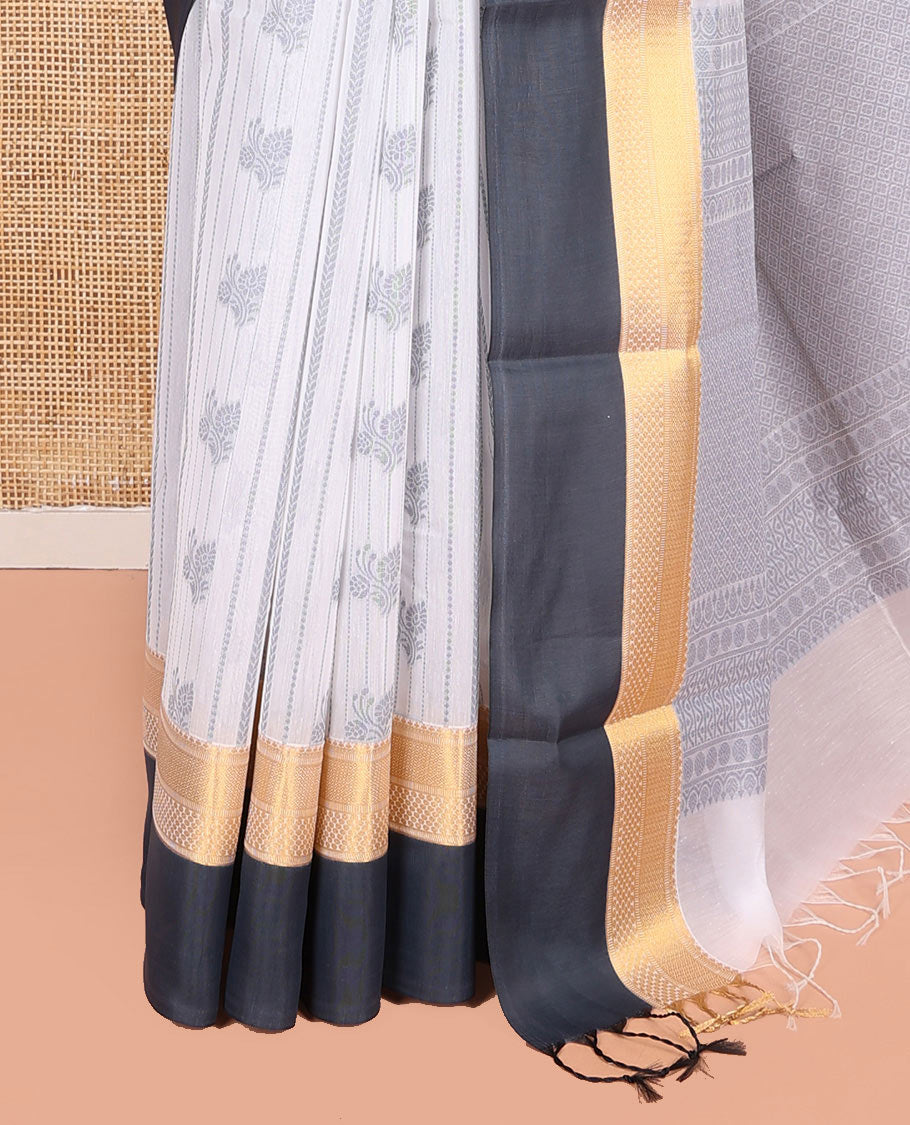 Grey Semi-Silk Cotton Saree, Embellished with Buttas and Stripes All Over Its Body, Complemented by a Contrast Traditional Zari Design Border, Pallu of Jaal Designs, and Paired with a Matching Blouse