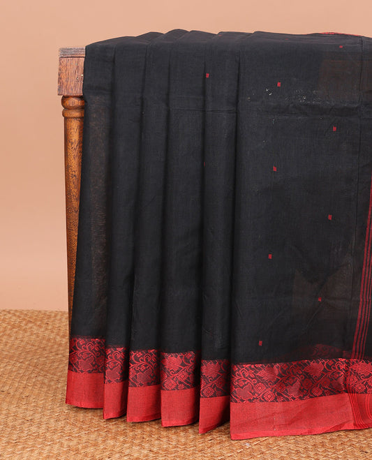 Black Bengal Cotton Saree, Beautified with Buttas All Over Its Body, Complemented by a Contrast Floral Creeper Border, and Pallu Steeped with Stripes