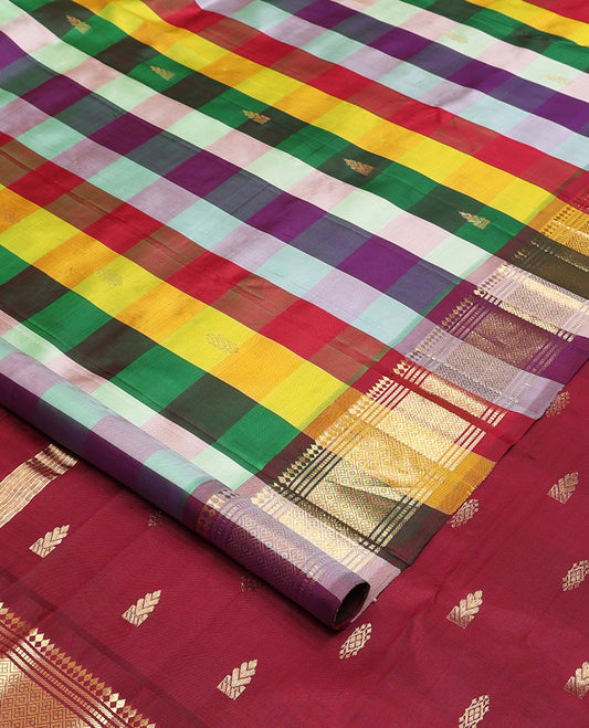 Multi-color paalum pazhamum style checked and zari buttas Kanchipuram silk saree, one-sided border of paneer sombu, banaras, muthu, and jaal and contrast zari design pallu