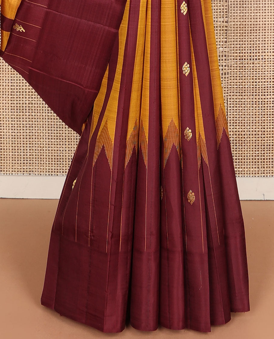 Maroon & yellow striped Kanchipuram silksaree with zari buttas, one-sided temple border & zari woven pallu