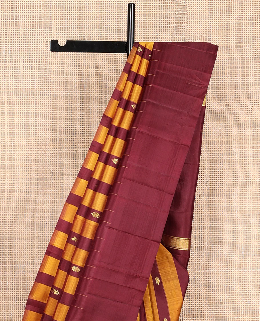 Maroon & yellow striped Kanchipuram silksaree with zari buttas, one-sided temple border & zari woven pallu