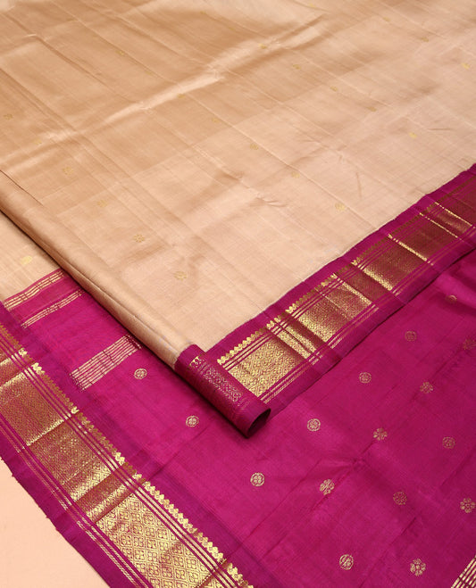 Sandal Kanchipuram Silk Saree, Beautifully Bedecked with Zari Buttas All Over Its Body, Complemented by a Contrast One-Sided Border of Salngai, Banaras, and Jaal Designs, Pallu of Zari Designs, and Comes Without a Blouse