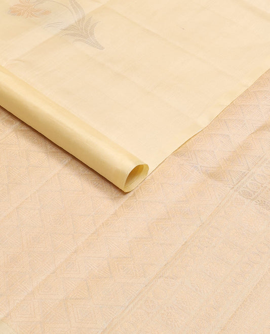 Borderless cream soft silk saree with floral zari buttas, self-pallu adorned with jaal design
