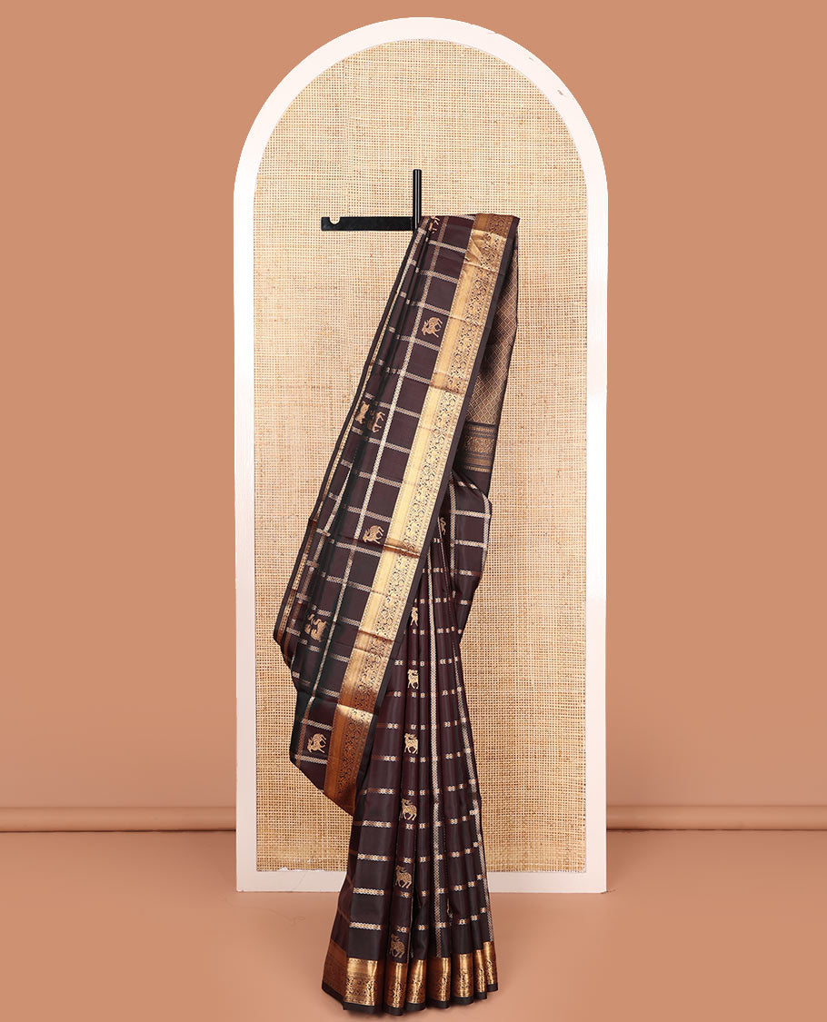 Brown maan and kuthirai butta enclosed checked soft silk saree, zari border of thilakam, mayil kann, kuthirai, and kamalam designs, and jaal pallu