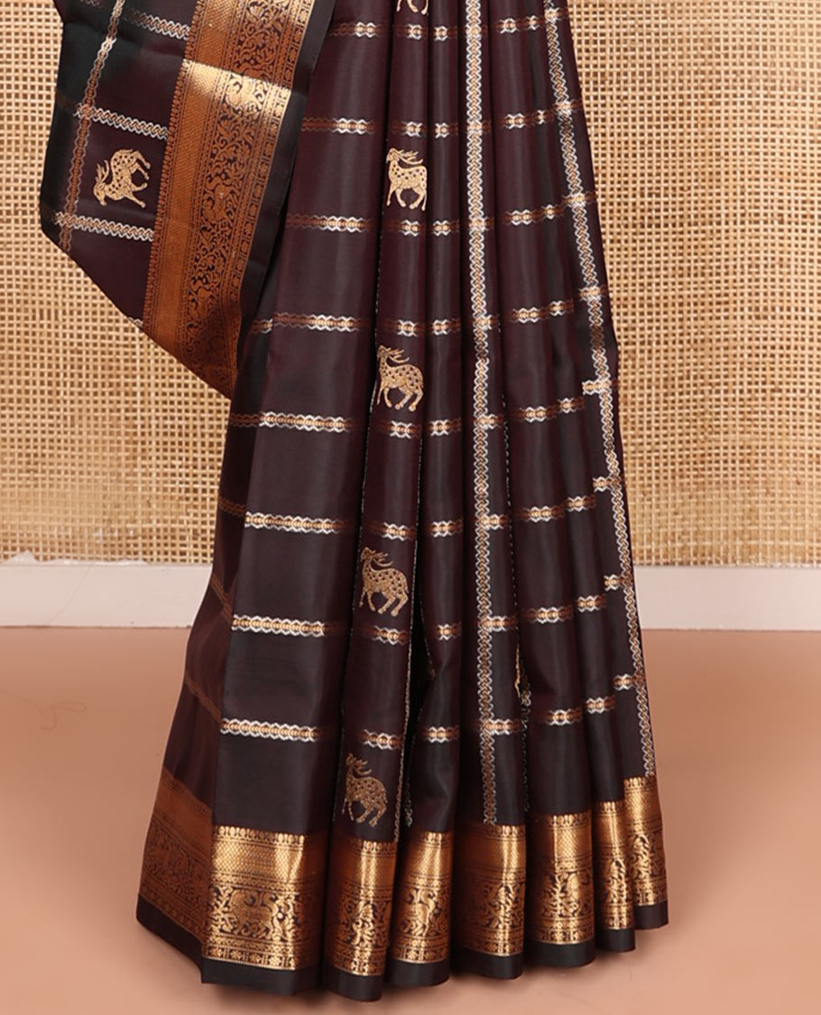 Brown maan and kuthirai butta enclosed checked soft silk saree, zari border of thilakam, mayil kann, kuthirai, and kamalam designs, and jaal pallu