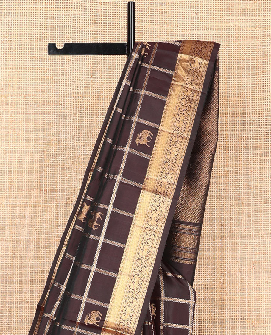Brown maan and kuthirai butta enclosed checked soft silk saree, zari border of thilakam, mayil kann, kuthirai, and kamalam designs, and jaal pallu