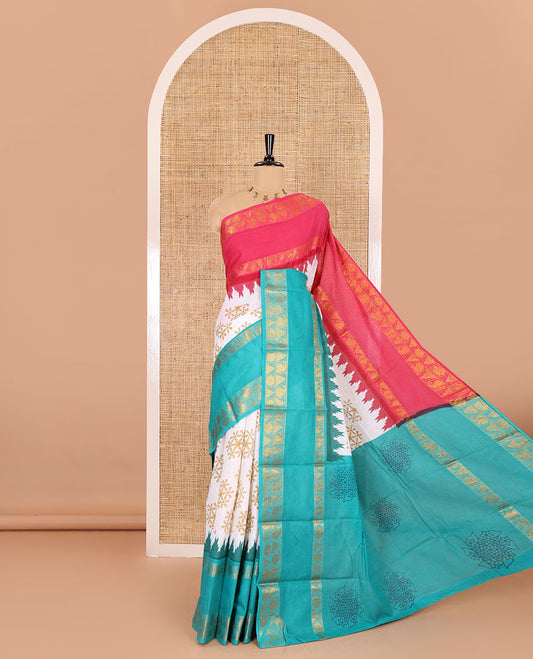 White kolam motifs printed Sungudi cotton saree, contrast pink-blue ganga jamuna rettai pettu traditional zari border, floral motifs pallu, and a contrast elephant motifs blouse
