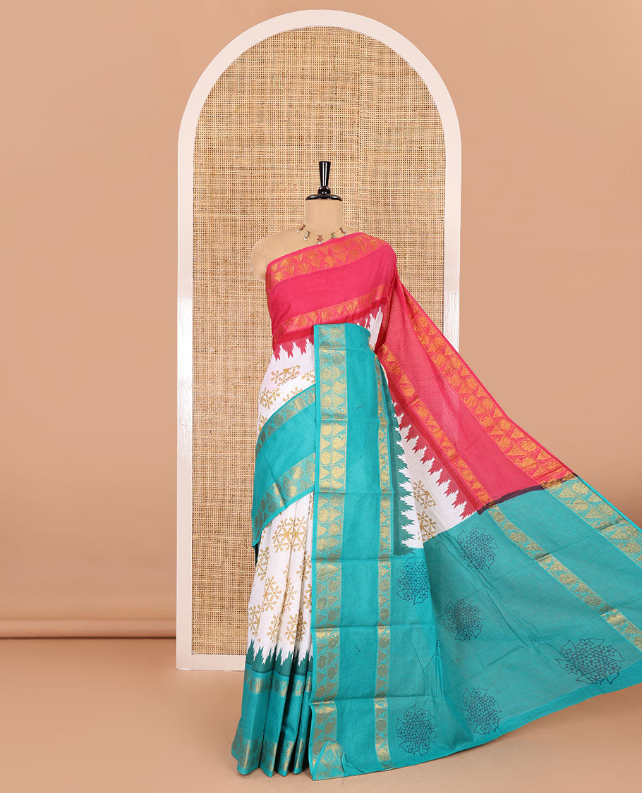 White kolam motifs printed Sungudi cotton saree, contrast pink-blue ganga jamuna rettai pettu traditional zari border, floral motifs pallu, and a contrast elephant motifs blouse