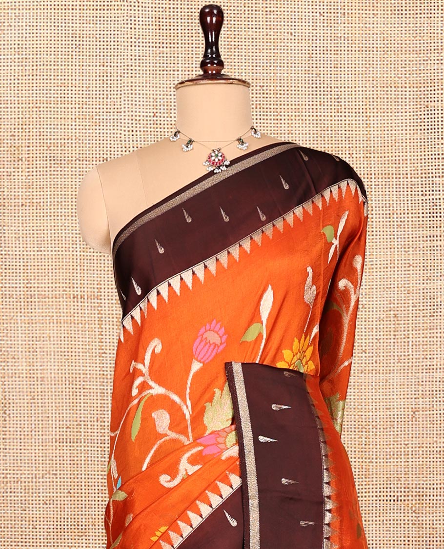 Orange Matka Silk Saree, Spotlighted with Meenakari Floral Vine All Over Its Body, Complemented by a Contrast Border of Traditional and Muniya Designs, Pallu of Floral Designs, and Paired with Contrast Blouse