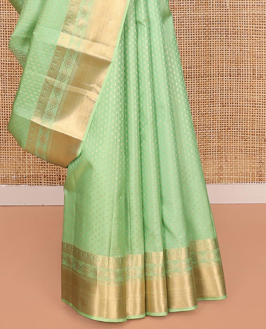 Green Vasundhara Silk Saree, Steeped with Zari Buttas on Its Body, Highlighted by a Zari Border of Traditional Designs, Richly Woven Jaal Pallu, and Paired with a Matching Blouse