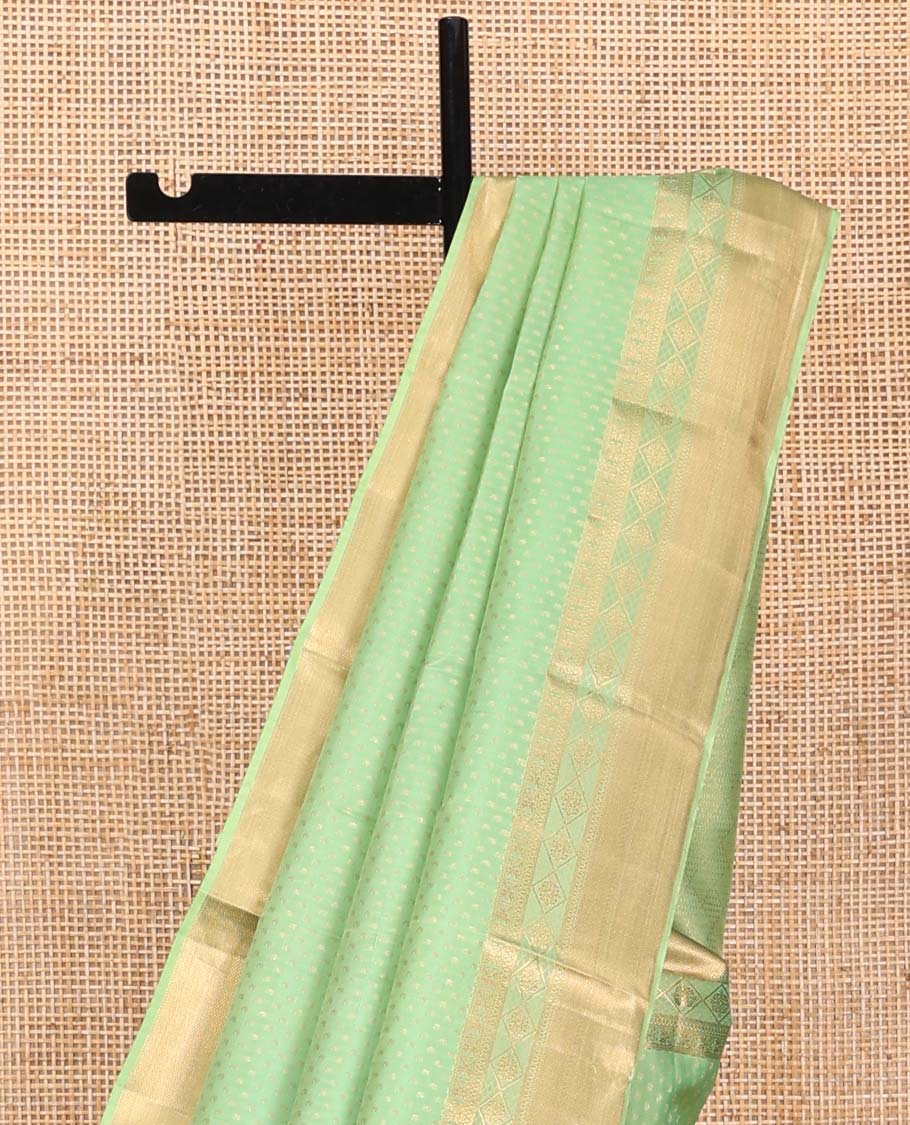 Green Vasundhara Silk Saree, Steeped with Zari Buttas on Its Body, Highlighted by a Zari Border of Traditional Designs, Richly Woven Jaal Pallu, and Paired with a Matching Blouse