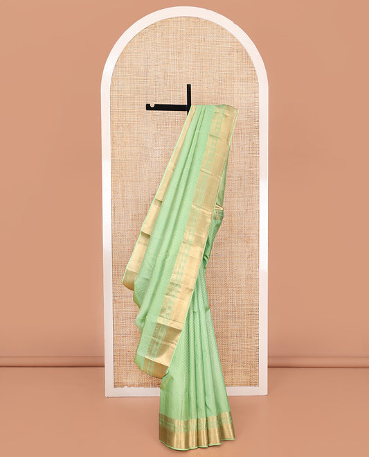 Green Vasundhara Silk Saree, Steeped with Zari Buttas on Its Body, Highlighted by a Zari Border of Traditional Designs, Richly Woven Jaal Pallu, and Paired with a Matching Blouse