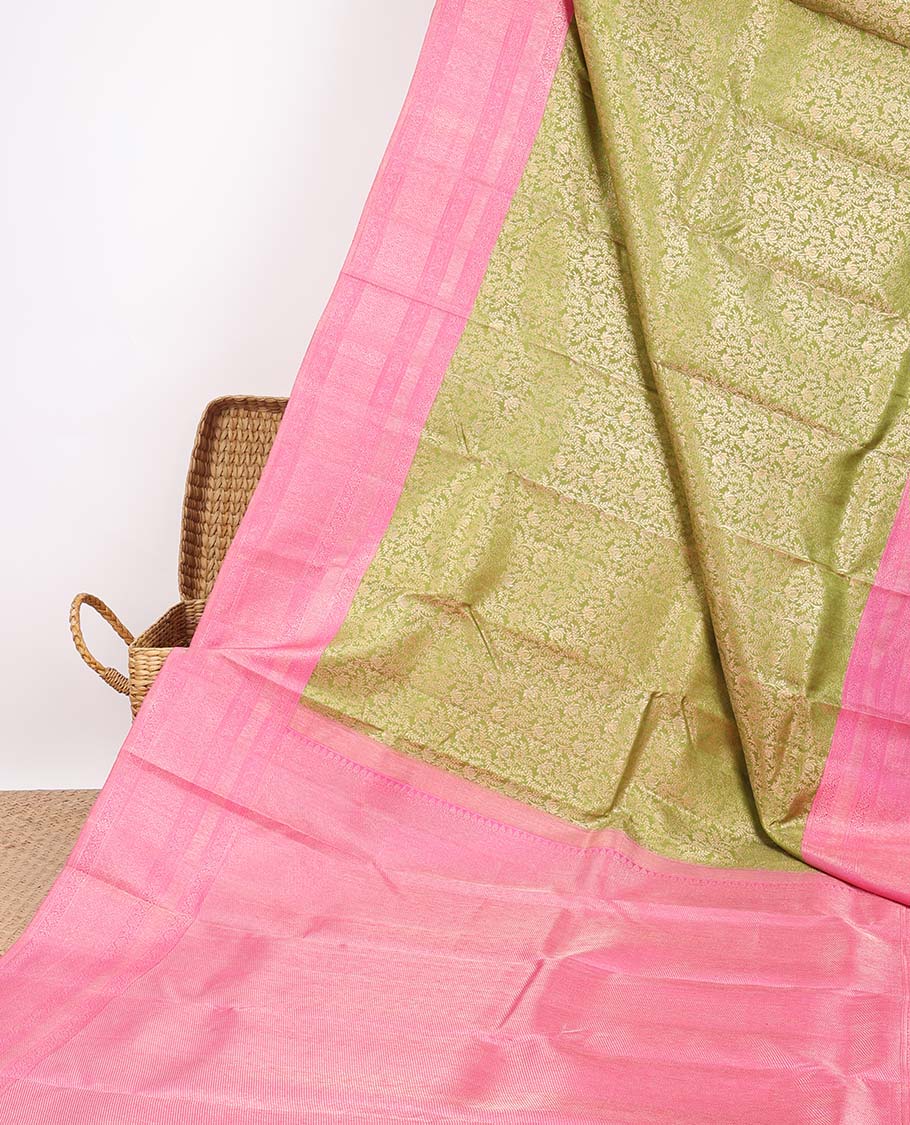 Green jacquard silk saree, contrast zari-enriched pallu & zari border of muthu,kodi visiry,vanki & mayil kann
