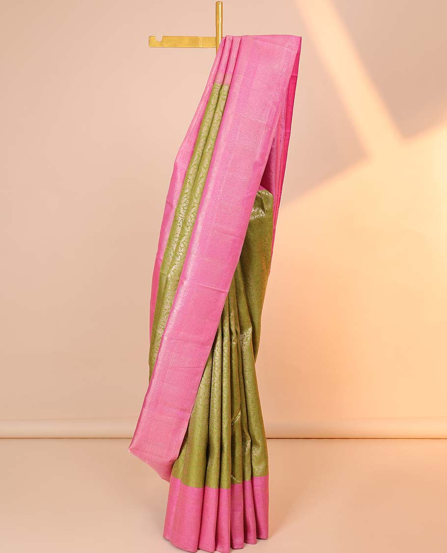 Green jacquard silk saree, contrast zari-enriched pallu & zari border of muthu,kodi visiry,vanki & mayil kann