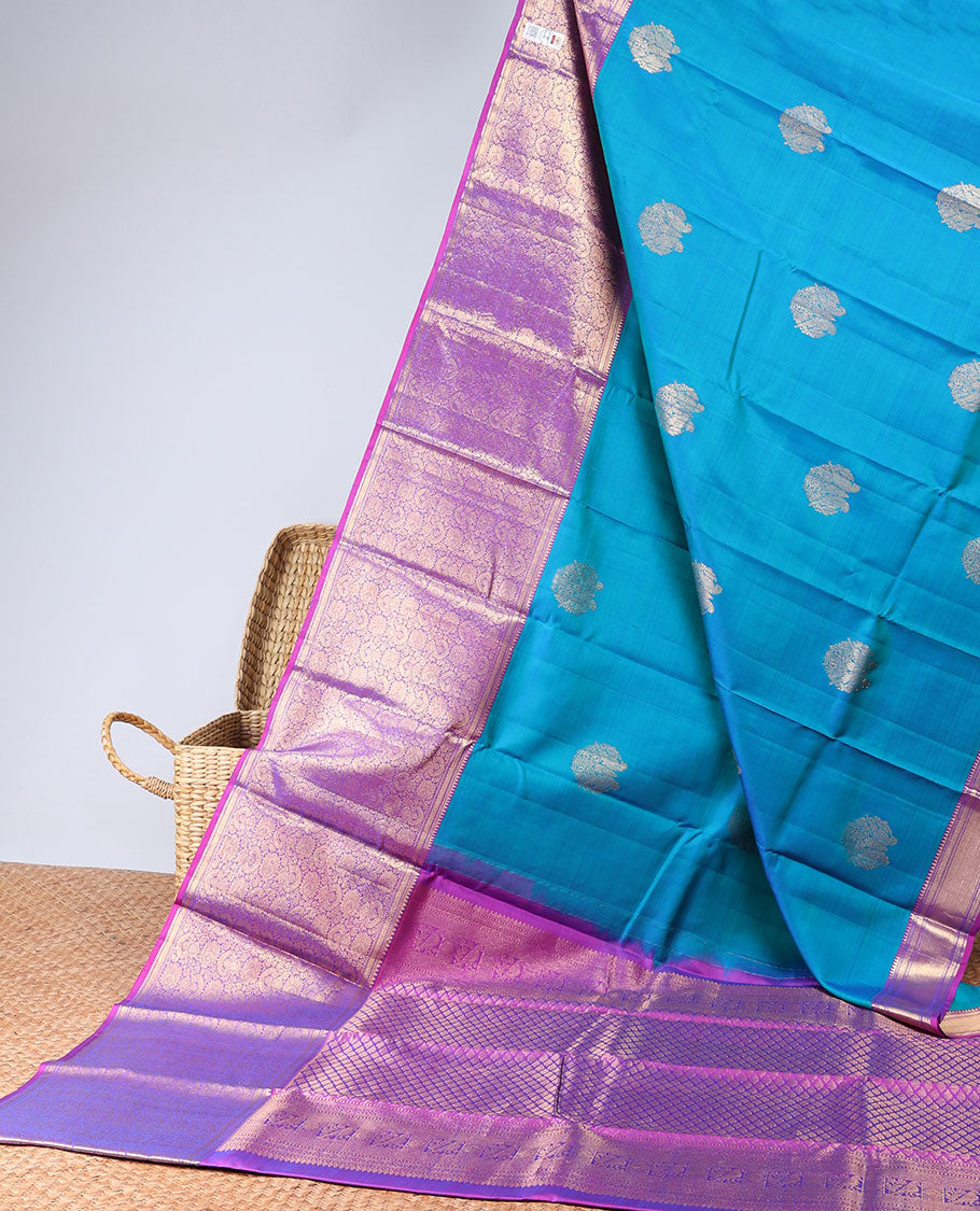 Blue silk saree with zari buttas, contrast intricate pallu & border of rekku,muthu,mayil kann & floral jaal designs