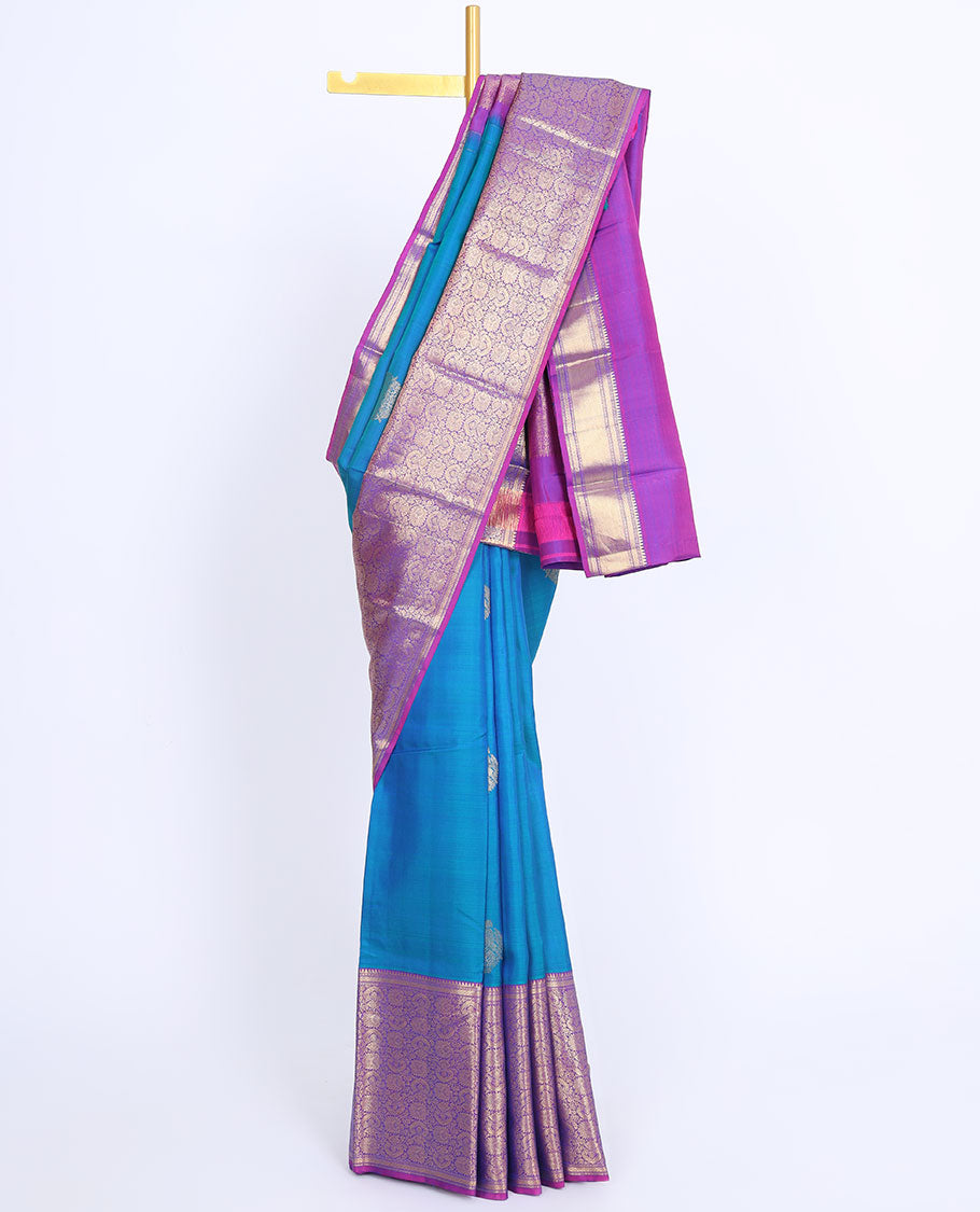 Blue silk saree with zari buttas, contrast intricate pallu & border of rekku,muthu,mayil kann & floral jaal designs