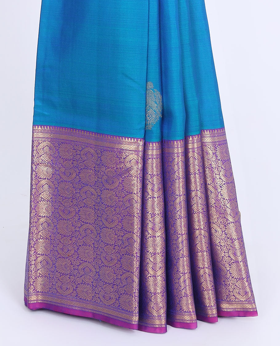 Blue silk saree with zari buttas, contrast intricate pallu & border of rekku,muthu,mayil kann & floral jaal designs