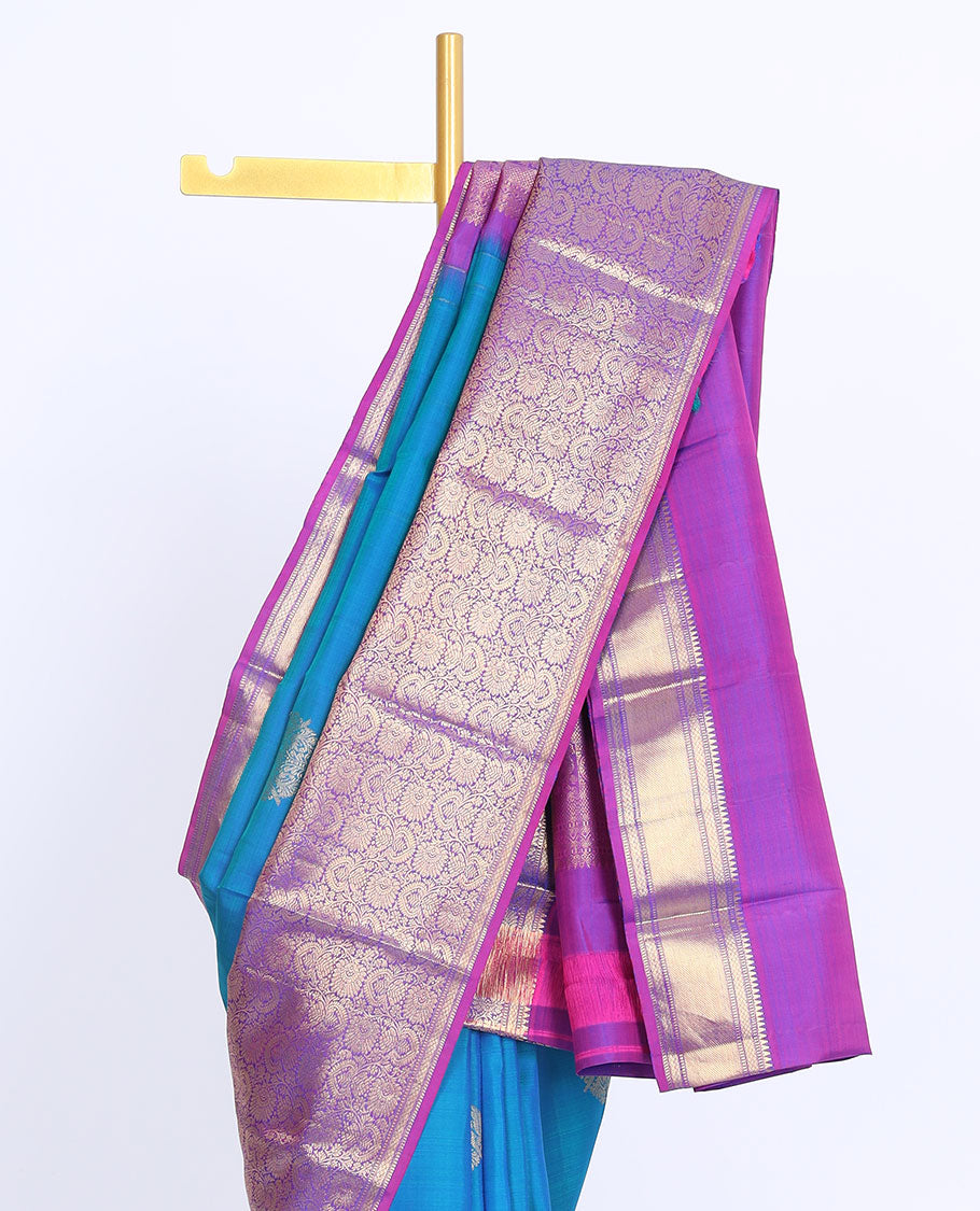 Blue silk saree with zari buttas, contrast intricate pallu & border of rekku,muthu,mayil kann & floral jaal designs