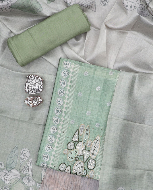 Green material churidar set, neck embroidery tissue top, plain santoon bottom & intricately printed tissue dupatta 