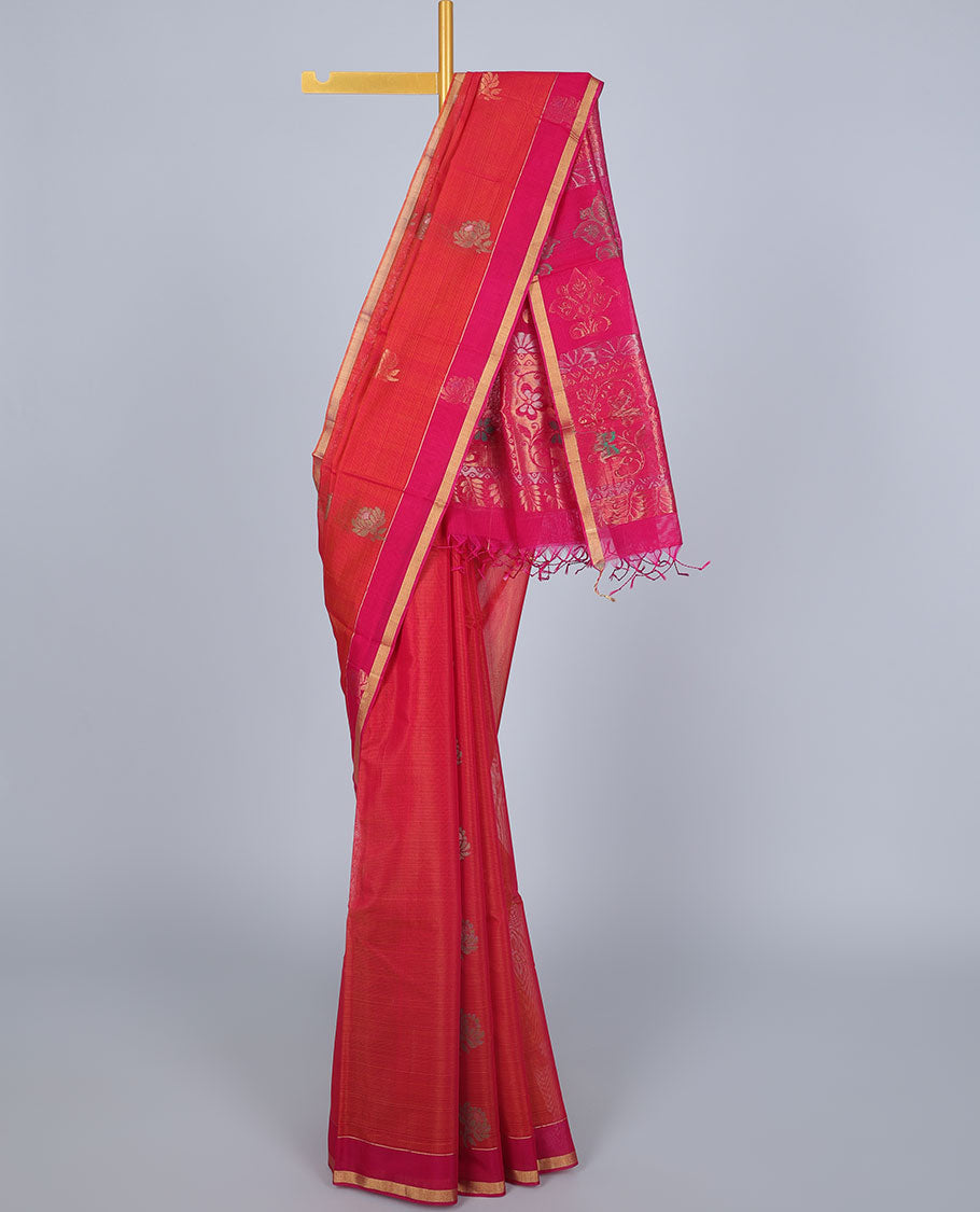 Orange silk cotton saree with buttas, contrast floral design border & pallu of intricate designs