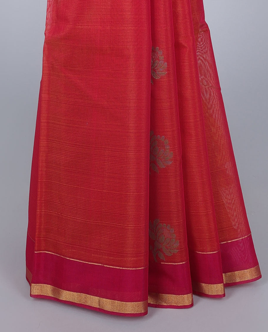Orange silk cotton saree with buttas, contrast floral design border & pallu of intricate designs