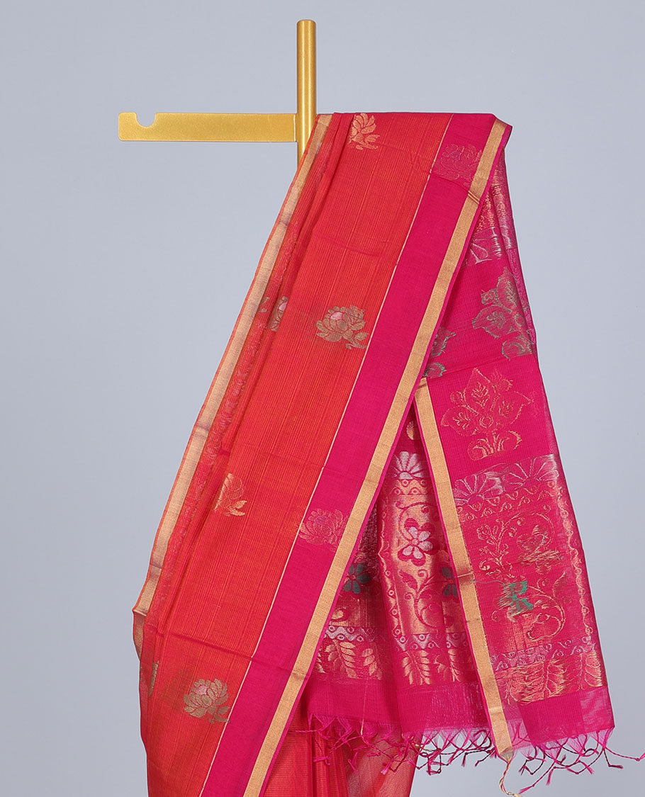 Orange silk cotton saree with buttas, contrast floral design border & pallu of intricate designs