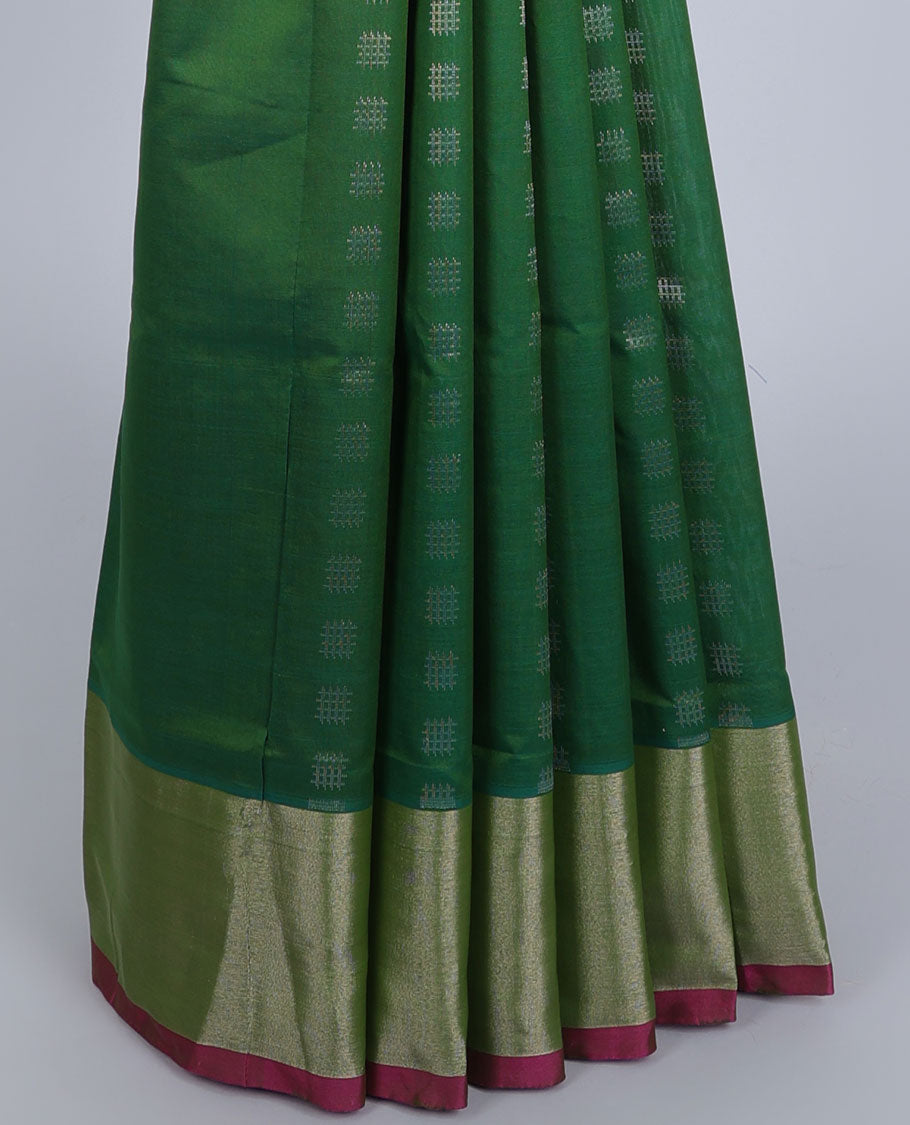Green kupadam cotton saree with buttas, plain border & contrast pallu of intricate zari designs