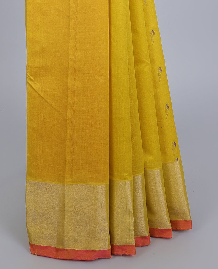 Yellow kupadam cotton saree with buttas, plain border & contrast pallu of floral designs