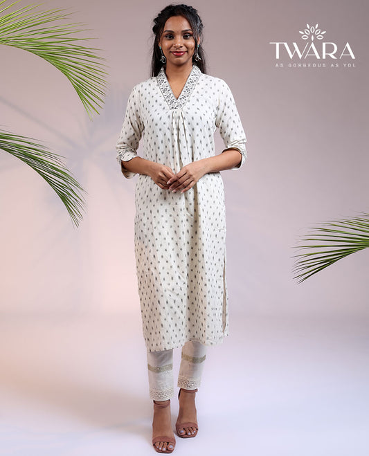 Twara cream unique buttas 3/4th sleeve & V-neck cotton straight-cut below-knee kurti
