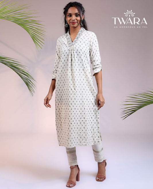 Twara cream unique buttas 3/4th sleeve & V-neck cotton straight-cut below-knee kurti