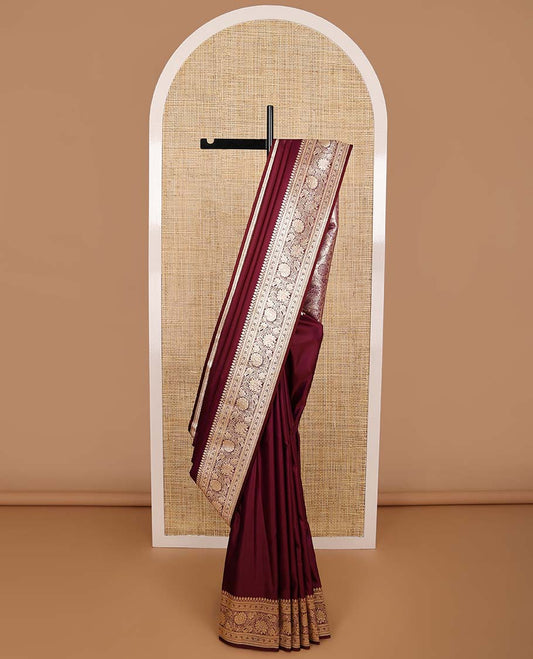 Maroon semi banaras nylon saree with self floral design border & floral ogee design pallu