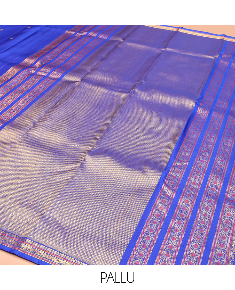 Royal Blue Kanchipuram Silk Saree, Elevated with Zari Buttas All Over Its Body, Highlighted by Zari Border of Salngai, Muthu, and Chakram Designs, Pallu of Mayil Kann Design, and Paired with a Matching Blouse
