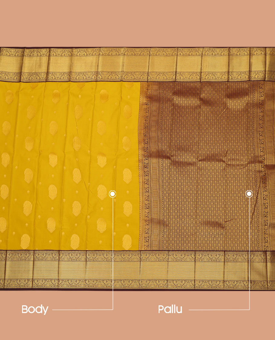 Yellow Budget Silk Saree, Subtly Sparkled with Paisley Buttas  All Over Its Body, Complemented by a Contrast Traditional Zari Design Border of Peacock Designs, Opulently Embellished Pallu, and Paired with a Contrast Blouse