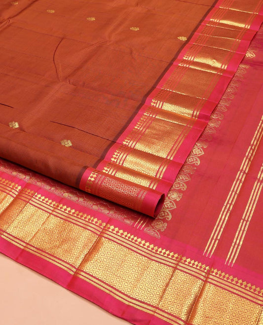Brown Kanchipuram Silk Saree, Elevated with Zari Buttas on Its Body, Complemented by a Contrast One-Sided Border of Panner Sombu, Banaras, and Mayil Kann Designs, Pallu Features Floral Creeper Designs, and Comes Without a Blouse