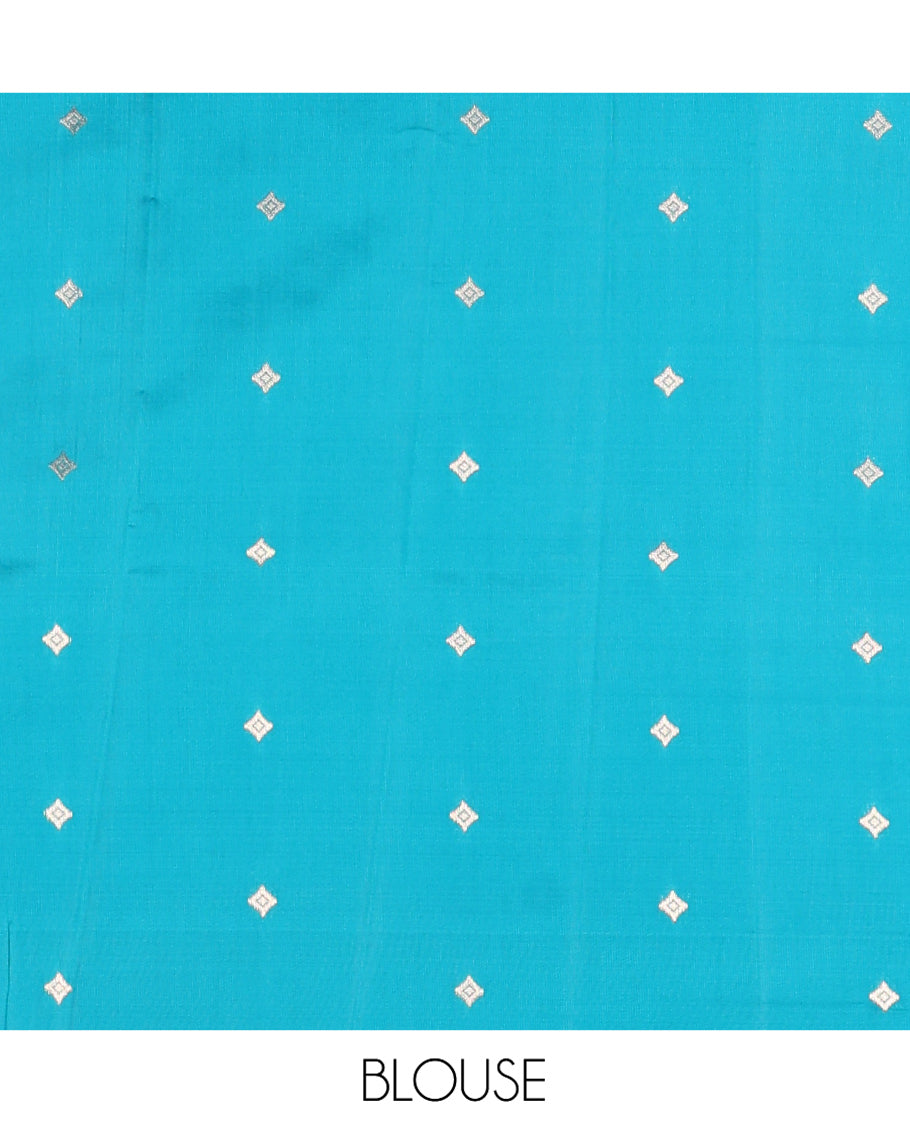 Pink Kanchi Silk Saree, Detailed with Peacock-Chakram Buttas All Over Its Body, Complemented by a Contrast Border of Floral Creeper Designs, an Intricately Designed Pallu, and Paired with a Matching Blouse