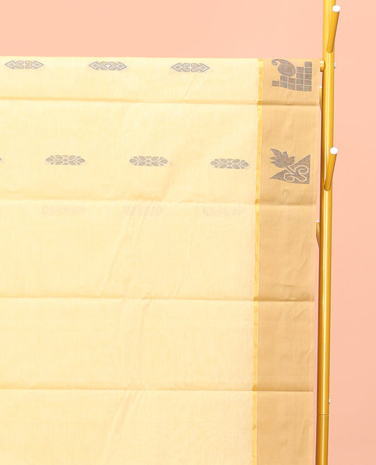 Yellow Kanchi Cotton Saree, Subtly Sparkled with Buttas All Over Its Body, Complemented by Contrast Border, Pallu of Floral Designs, and Paired with a Matching Blouse
