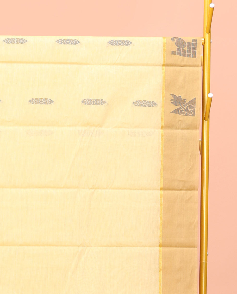 Yellow Kanchi Cotton Saree, Subtly Sparkled with Buttas All Over Its Body, Complemented by Contrast Border, Pallu of Floral Designs, and Paired with a Matching Blouse