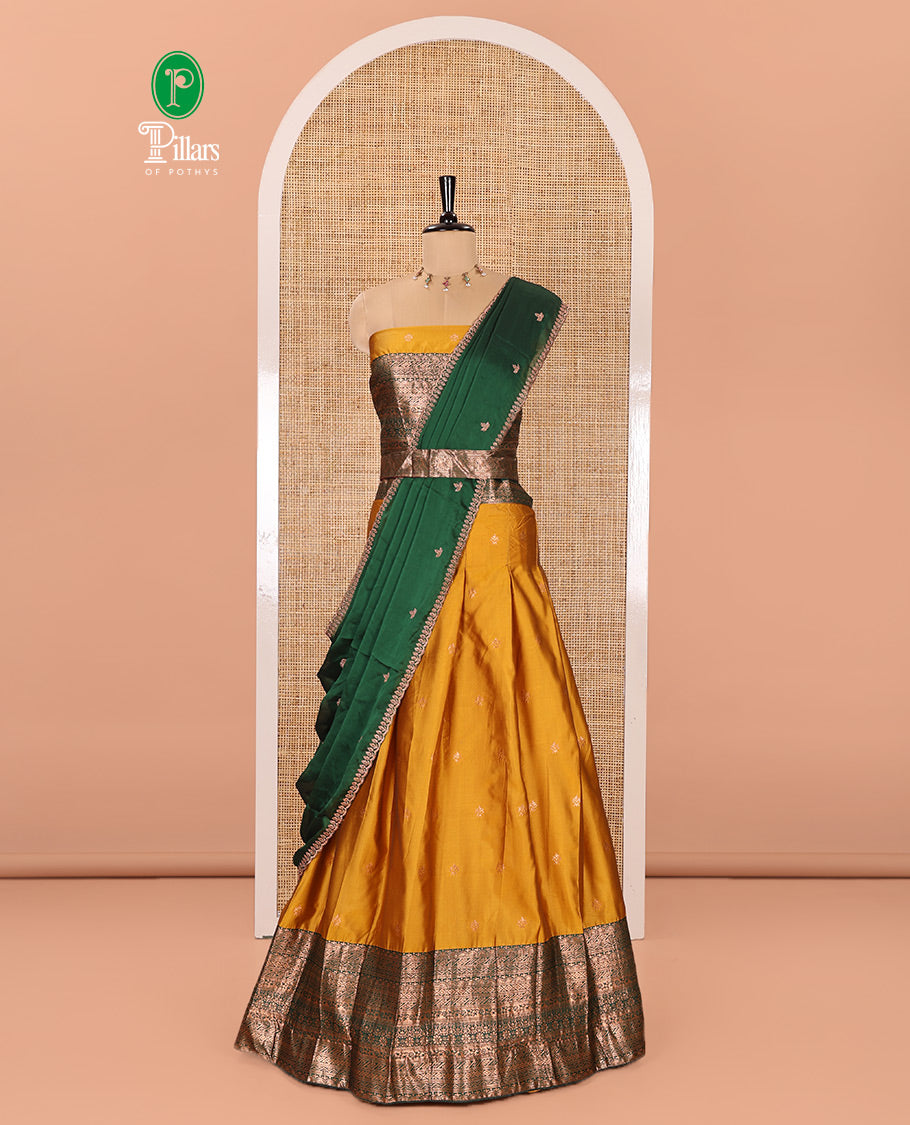 Yellow and Green Semi-Banarasi Half-Saree Beautifully Bedecked with Zari Buttas on Its Skirt, Complemented by a Contrast Traditional Zari Design Border, Paired with a Matching Blouse, and a Satin Georgette Embroidered Scallop Dhavani